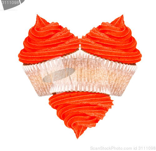 Image of Three cupcakes with red icing in a heart shape