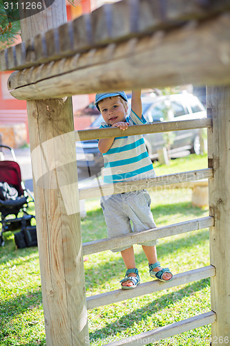 Image of Boy playing on the stairs