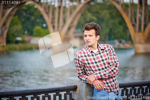 Image of Handsome man outdoors over urban background