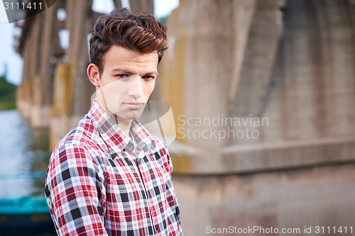 Image of Handsome man outdoors over urban background