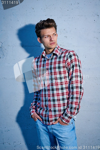 Image of Handsome man outdoors over urban background