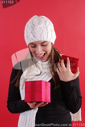 Image of Girl surprised opening gift