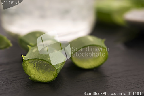 Image of aloe vera juice with fresh leaves 