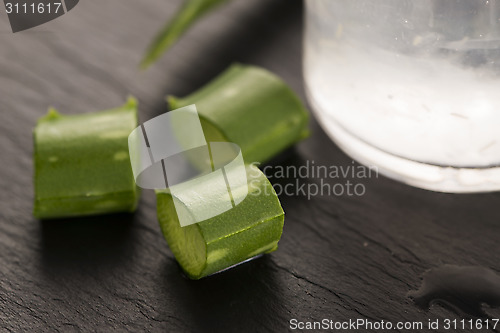 Image of aloe vera juice with fresh leaves 