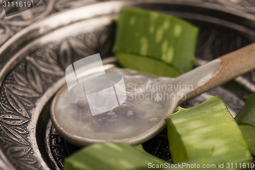 Image of aloe vera juice with fresh leaves 