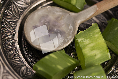 Image of aloe vera juice with fresh leaves 