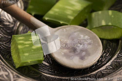 Image of aloe vera juice with fresh leaves 