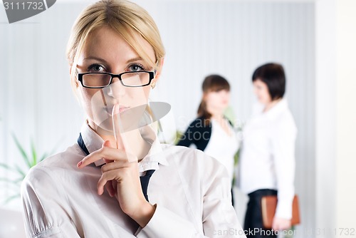 Image of Attractive woman with sign "keep silence"