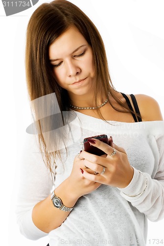 Image of Attractive girl writing sms