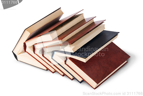 Image of Six old books imbedded in one another top and front view