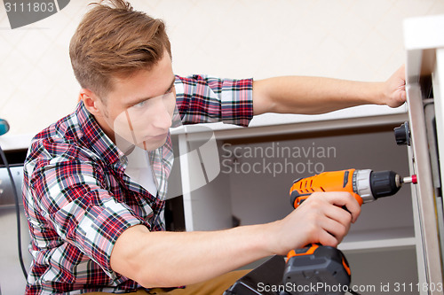 Image of repairman screwdriver works