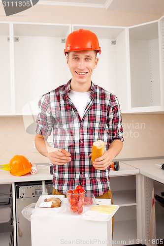 Image of smiling worker dines