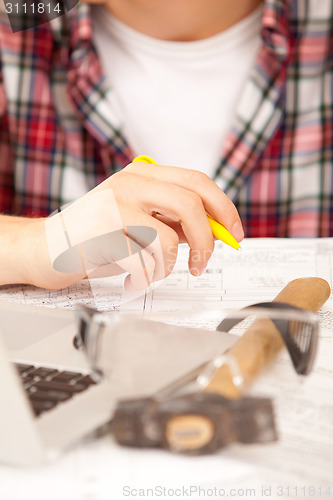 Image of engineer hands with pen