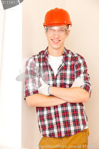 Image of young smiling construction worker