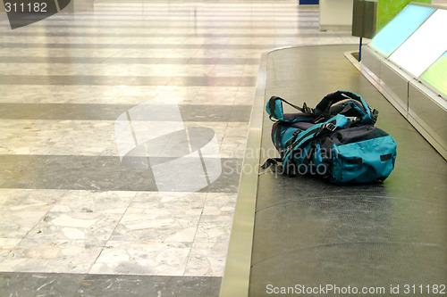 Image of backpack on conveyor