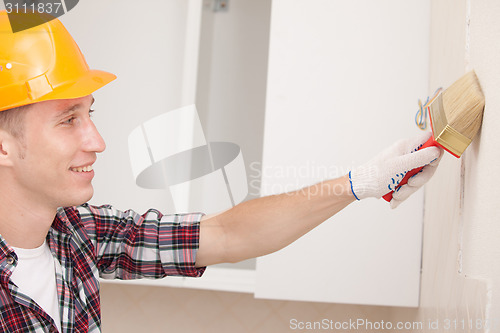 Image of worker with paint brush