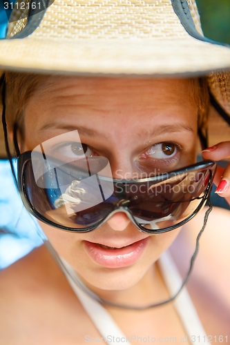 Image of Woman outdoors with nice hat