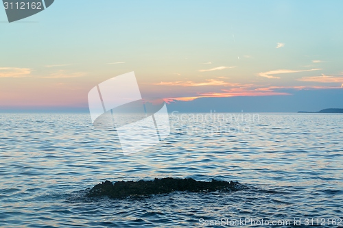 Image of Beach with rocks and a cloudy sky