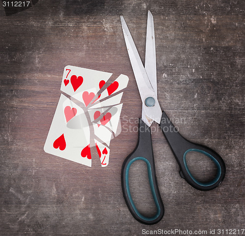 Image of Concept of addiction, card with scissors