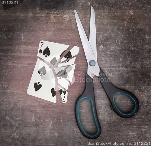 Image of Concept of addiction, card with scissors