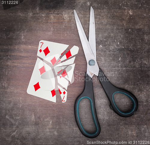 Image of Concept of addiction, card with scissors