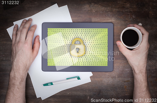 Image of Tablet on a desk, concept of data protection