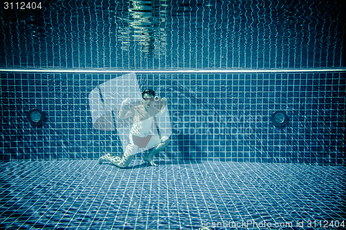 Image of Underwater pool portraying Superman