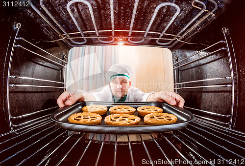 Image of Chef cooking in the oven.