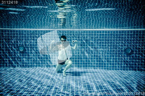 Image of Underwater pool portraying Superman