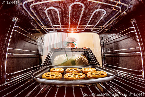 Image of Chef cooking in the oven.