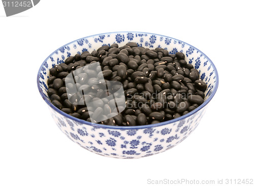 Image of Black turtle beans in a blue and white china bowl