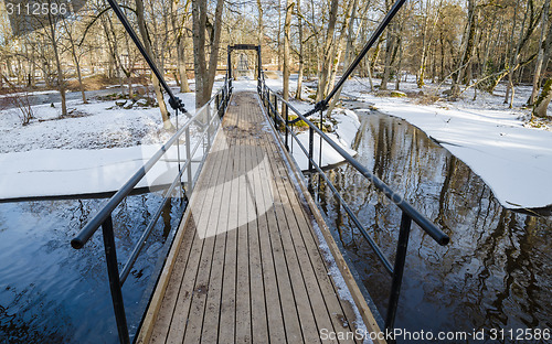 Image of Bridge across the canal in the spring