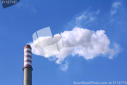 Image of Smoke clouds from a high concrete chimney