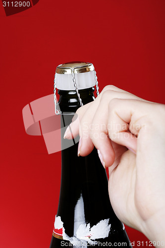 Image of Opening champagne bottle