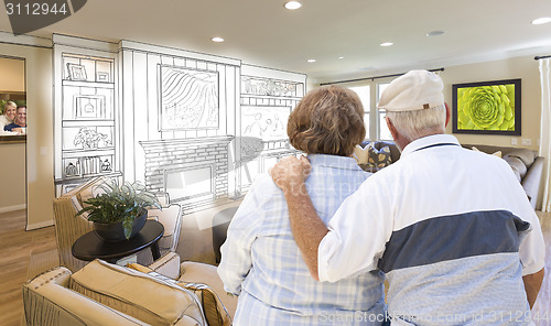 Image of Senior Couple Over Custom Living Room Design Drawing and Photo