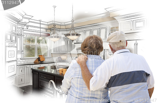 Image of Senior Couple Looking Over Custom Kitchen Design Drawing and Pho