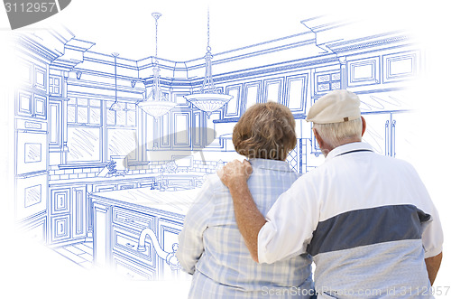 Image of Senior Couple Looking Over Blue Custom Kitchen Design Drawing