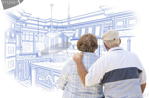 Image of Senior Couple Looking Over Blue Custom Kitchen Design Drawing