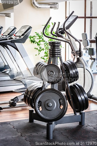 Image of Barbell plates rack in the gym