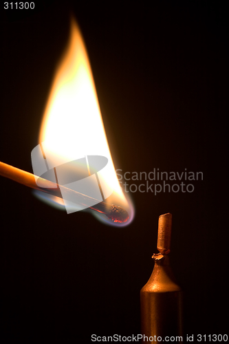 Image of Lighting a candle.