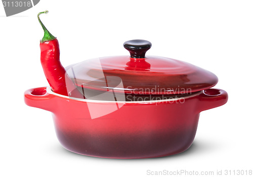 Image of Red chili pepper in saucepan with lid