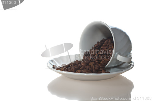 Image of Coffee cup full of coffee beans