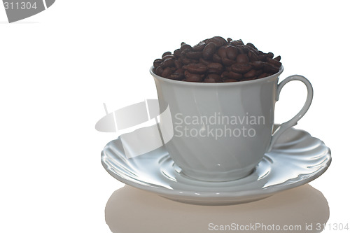 Image of Coffee cup full of coffee beans