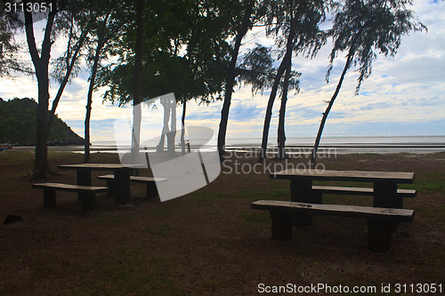 Image of stone  bench with sea background