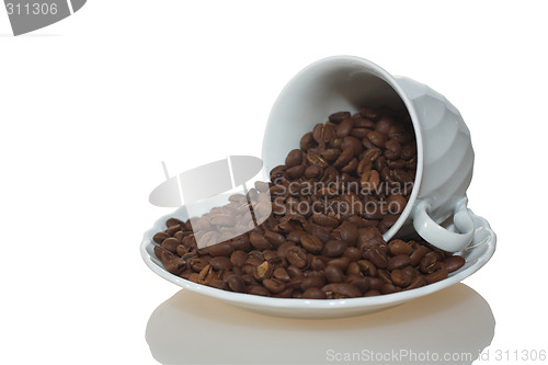 Image of Coffee cup full of coffee beans