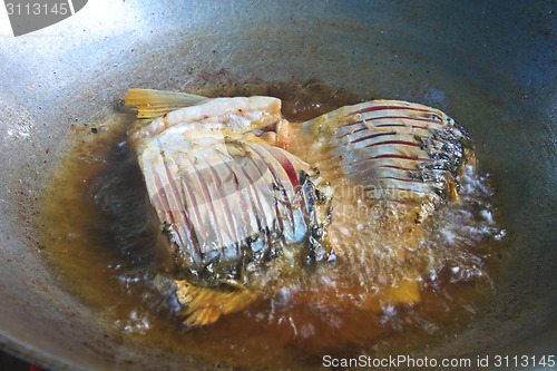 Image of Fried fish in a frying pan