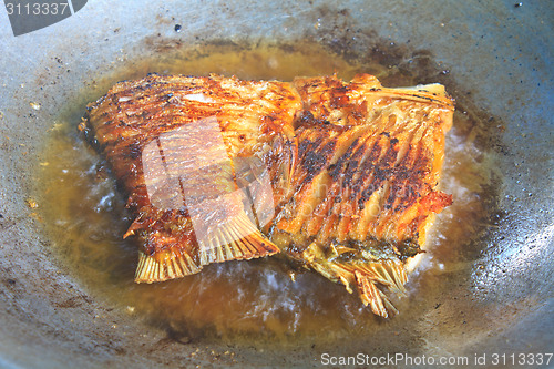 Image of Fried fish in a frying pan