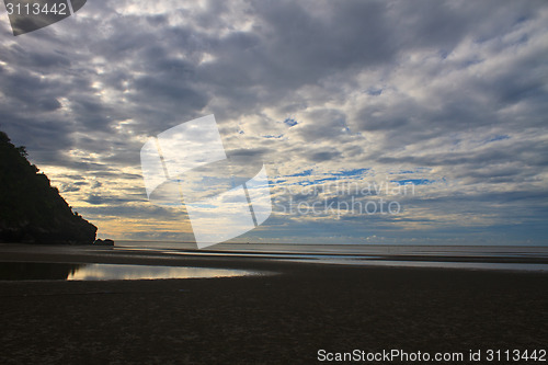 Image of beautiful sunrise on beach and tropical sea