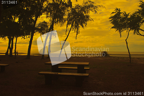 Image of stone  bench with sea background