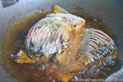 Image of Fried fish in a frying pan